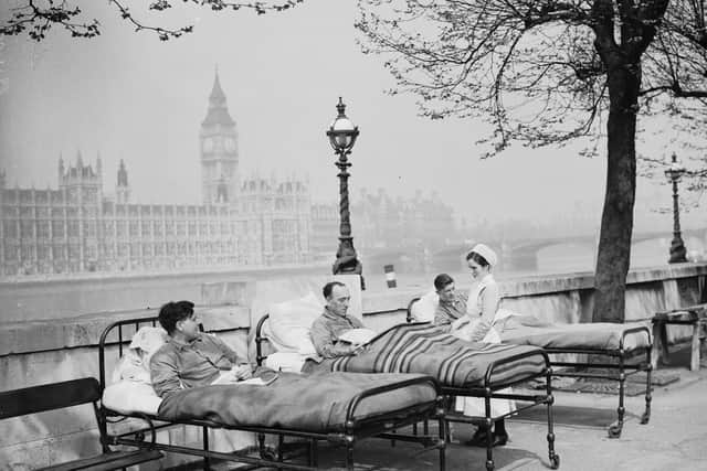 Tuberculosis patients from St. Thomas' Hospital rest in their beds in the open air by the River Thames in 1936 (Photo: Fox Photos/Getty Images)