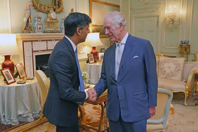 King Charles III with Prime Minister Rishi Sunak at Buckingham Palace, London, for their first in-person audience since the King's diagnosis with cancer. Jonathan Brady/PA Wire