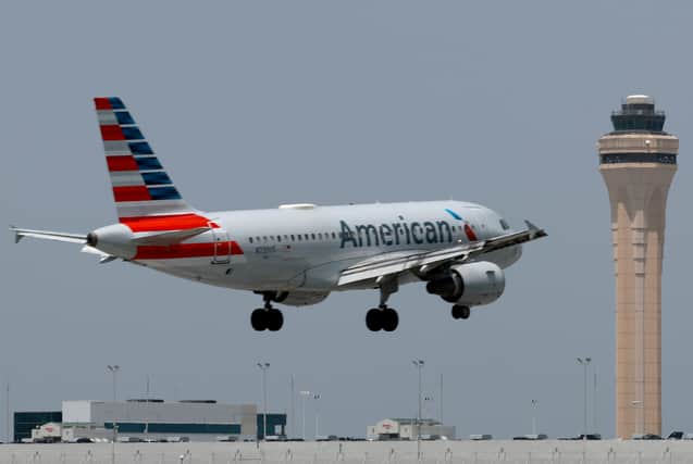Fearless passengers on board an American Airlines flight restrained a man, duct-taping his feet, after he tried to open emergency exit door mid-air. (Photo: Getty Images)