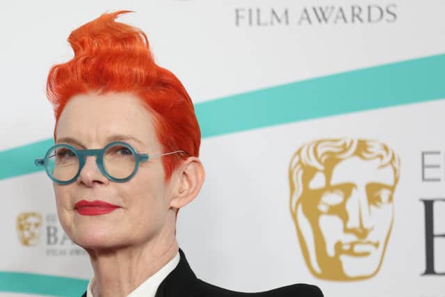 British costume designer Sandy Powell poses on the red carpet upon arrival at the BAFTA British Academy Film Awards at the Royal Festival Hall, Southbank Centre, in London, on February 19, 2023. (Photo by ISABEL INFANTES / AFP) 