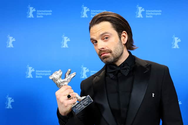 Romanian-US actor Sebastian Stan poses with his Silver Bear for Best Leading Performance for the film "A Different Man"  backstage during the awards ceremony of the 74th Berlinale International Film Festival, on February 24, 2024 in Berlin. (Photo by NADJA WOHLLEBEN / POOL / AFP)