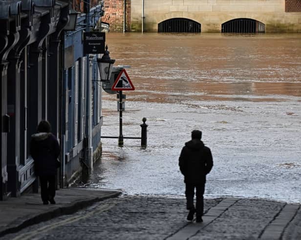 According to the Met Office, it is southern districts that are bearing the brunt of the rainfall. A man walks down a lane facing a street flooded by the River Ouse after it burst its banks, in central York, on January 24, 2024 following Storm Jocelyn which brought strong winds and heavy rain across the country. (Photo by Paul ELLIS / AFP) (Photo by PAUL ELLIS/AFP via Getty Images)







