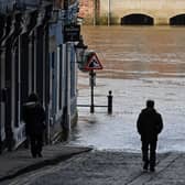 According to the Met Office, it is southern districts that are bearing the brunt of the rainfall. A man walks down a lane facing a street flooded by the River Ouse after it burst its banks, in central York, on January 24, 2024 following Storm Jocelyn which brought strong winds and heavy rain across the country. (Photo by Paul ELLIS / AFP) (Photo by PAUL ELLIS/AFP via Getty Images)







