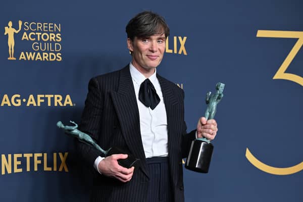 Irish actor Cillian Murphy poses in the press room with the awards for Outstanding Performance by a Male Actor in a Leading Role in a Motion Picture and Outstanding Performance by a Cast in a Motion Picture for "Oppenheimer" during the 30th Annual Screen Actors Guild awards at the Shrine Auditorium in Los Angeles, February 24, 2024. (Photo by Robyn BECK / AFP)