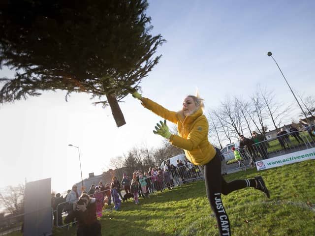 A woman tried to sue her insurance company for £650,000 after claiming she lost out on work after she was severely injured in a car crash - only to be pictured winning a Christmas tree throwing competition. Picture: Eamon Ward / SWNS