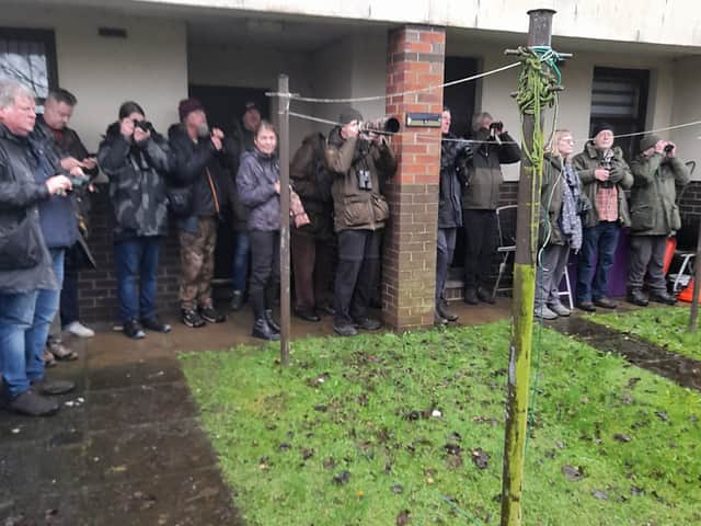 Some 450 birdwatchers have flocked to the garden hoping to catch a glimpse (Photo: Rick Dunlop/SWNS)