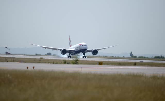 A video shared on social media shows the moment a British Airways plane aborted landing at Heathrow Airport due to strong winds. (Photo: AFP via Getty Images)