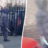 Chilling footage captures the moment a hooded knifeman casually walks down a street while brandishing a huge blade near a primary school
 