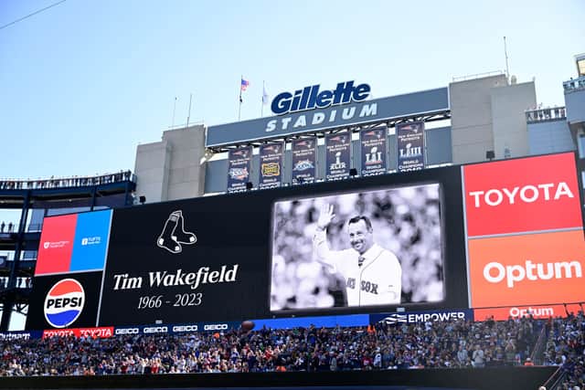 A photo honouring former Boston Red Sox pitcher Tim Wakefield is displayed on the scoreboard during a game between the New England Patriots and the New Orleans Saints at Gillette Stadium on October 08, 2023 in Foxborough, Massachusetts. (Photo by Maddie Malhotra/Getty Images)