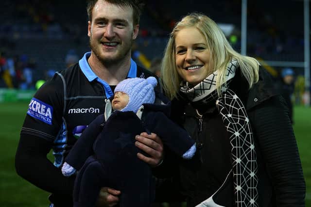 Stuart Hogg of Glasgow Warriors posed for a picture with Gillian and baby Archie during the European Rugby Champions Cup pool 3 match between Glasgow Warriors and Racing 92 at Rugby Park on January 23, 2016 in Kilmarnock, Scotland. (Photo by Mark Runnacles/Getty Images)