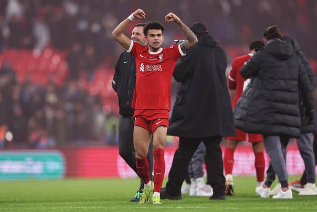 Luiz Diaz celebrates after Liverpool win the EFL Carabao Cup.