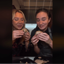 TV personality Megan McKenna and her sister Milly are among those who have tried the viral flying dutchman burger which foodies are loving on TikTok. Photo by TikTok/MeganMcKenna.