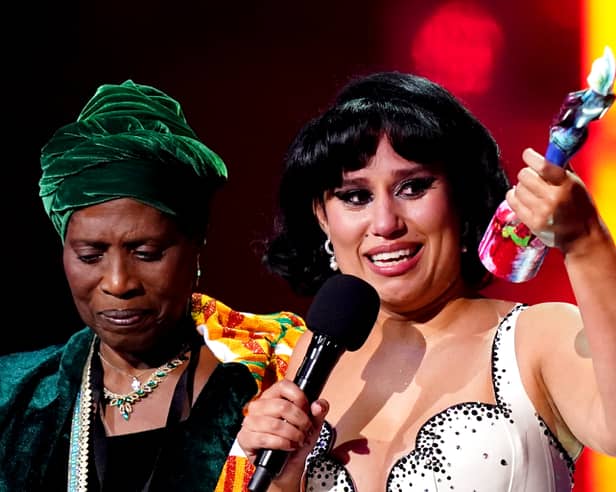 Raye (right) on stage with her grandmother after winning the Mastercard Album of the Year award during the Brit Awards 2024 