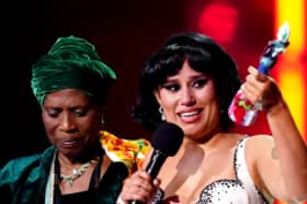 Raye (right) on stage with her grandmother after winning the Mastercard Album of the Year award during the Brit Awards 2024 