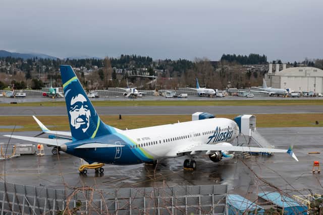 Three passengers on board the Alaska Airlines flight that saw a door plug blow out are suing the airline and Boeing for $1bn. (Photo: AFP via Getty Images)