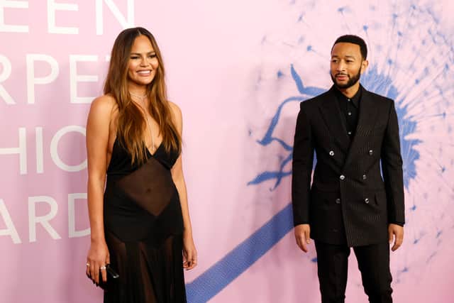 WEST HOLLYWOOD, CALIFORNIA - MARCH 06: (L-R) Chrissy Teigen and John Legend attend the 2024 Green Carpet Fashion Awards at 1 Hotel West Hollywood on March 06, 2024 in West Hollywood, California. (Photo by Frazer Harrison/Getty Images)