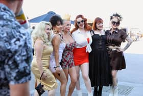 (L-R) Tracy Lashes, Delilah, Masuimi Max, Minxie Mimieux, Porcelain, and Shannon Brooke stand for a photo during the Viva Las Vegas Rockabilly Weekender classic car show in Las Vegas, Nevada, on April 29, 2023. - The notorious rockabilly music weekend, celebrating 26 years, draws approximately 20,000 attendees annually. (Photo by Ronda Churchill / AFP)