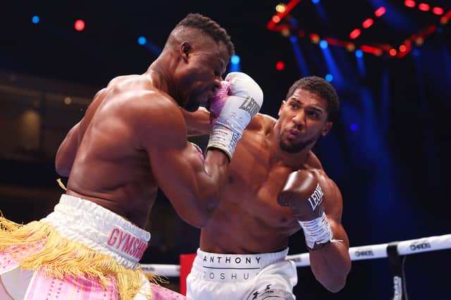 Anthony Joshua punches Francis Ngannou during their heavyweight fight in the Kingdom Arena in Riyadh, Saudi Arabia. 