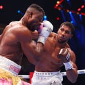 Anthony Joshua punches Francis Ngannou during their heavyweight fight in the Kingdom Arena in Riyadh, Saudi Arabia. 
