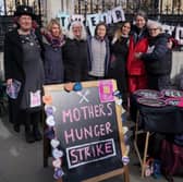 Mothers, (left to right) Anna Palmer, Grace Thompson, Erika Curren, Karen Gilmore, Jo Hook, Chantelle Norton, and Emma Hopkins, who will begin a five-day hunger strike outside Parliament on Mother's Day 2024 to draw attention to parents in the UK who are skipping meals to feed their children. Photo by Jonathan Brady/PA Wire.