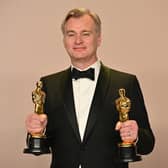  British director Christopher Nolan poses in the press room with the Oscars for Best Director and Best Picture for Oppenheimer during the 96th Annual Academy Awards at the Dolby Theatre in Hollywood, California on March 10, 2024. (Photo by Robyn BECK / AFP)