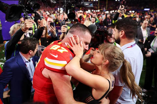 ravis Kelce #87 of the Kansas City Chiefs and Taylor Swift embrace after defeating the San Francisco 49ers 25-22 in overtime during Super Bowl LVIII at Allegiant Stadium on February 11, 2024 in Las Vegas, Nevada. (Photo by Ezra Shaw/Getty Images)