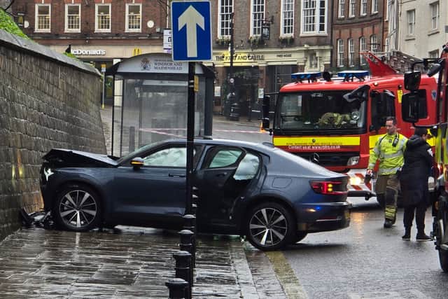 Emergency service attended the scene outside Windsor Castle after a car crashed on River Street. (Credit: SWNS)