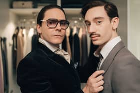 Daniel Bruhl (left) takes on the role of controversial designer Karl Lagerfeld in Disney+'s "Being Karl Lagerfeld" - premiering at Cannes 2024 next month (Credit: Disney+)