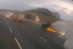 The Mitsubishi hit by drink-driver Nilen Chauhan which flipped, skidded and burst into flames on the A14 Picture taken from video released by Cambridgeshire Police 