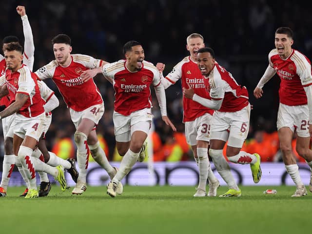 Arsenal celebrate reaching the last eight of the UEFA Champions League