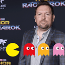 Christopher Yost, known for his writing work on "The Mandalorian" and "Thor: Ragnarok," is set to pen the script for the upcoming "Pac Man" live action film (Credit: Getty/Adobe Stock)
