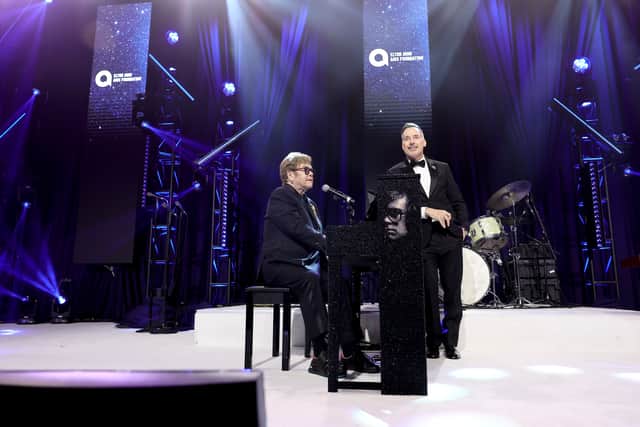 Elton John and David Furnish onstage during the Elton John AIDS Foundation's 32nd Annual Academy Awards Viewing Party on March 10, 2024
