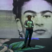 People attend an immersive Frida Kahlo show in Bogota on June 10, 2023. (Photo by Juan BARRETO / AFP)