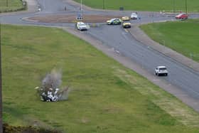 Video grab of a controlled explosion in New Brighton in a park known as The Dips, Merseyside. March 12 2024.  A bomb has been set off in a controlled explosion in the Wirral, Merseyside. The explosion, which took place in New Brighton in a park known as The Dips, took place just after 2pm today (March 12).  Paul Boyd, 60, whose flat overlooks the area, managed to film the explosion from his home. 
