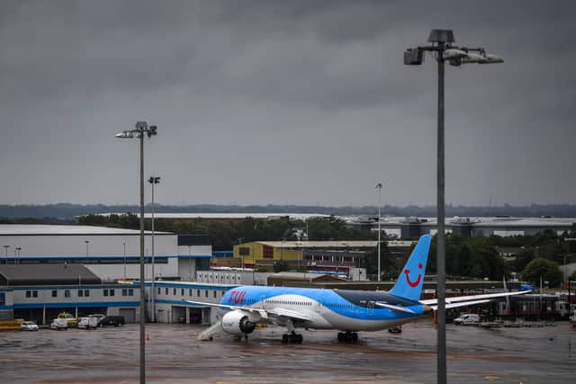 Armed police boarded a TUI flight at Manchester Airport moments after it touched down on the runway and arrested a man. (Photo: AFP via Getty Images)