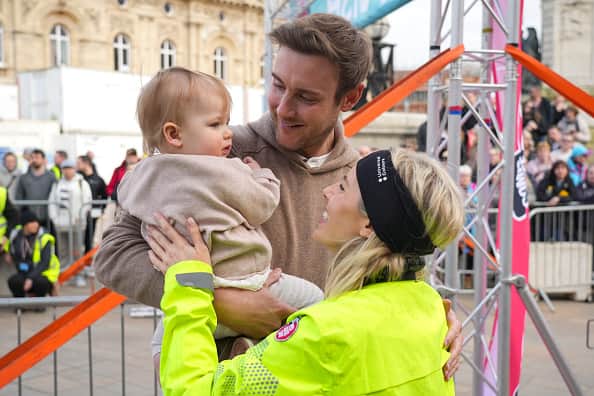 Singer and Radio DJ, Mollie King with her family husband Stuart Board and daughter Annabella after completing the fifth and final day of her 500km cycle challenge  across England to raise money for Red Nose Day. On March 15, 2024 in Hull, England. (Photo by Dominic Lipinski/Getty Images)
