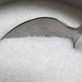 A spoon in a bowl of white sugar Picture: Canva