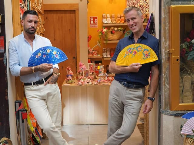 Giovanni and Anton outside the fan shop in Seville, Spain (Image: BBC/BBC Studios)