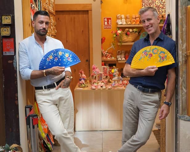 Giovanni and Anton outside the fan shop in Seville, Spain (Image: BBC/BBC Studios)