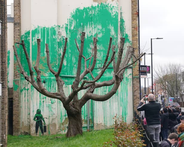 Banksy caused a scene at a block of flats in Finsbury Park after fans flocked to the area to see a new mural by the famous street artist. (Credit: Jonathan Brady/PA Wire)