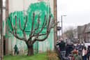 Banksy caused a scene at a block of flats in Finsbury Park after fans flocked to the area to see a new mural by the famous street artist. (Credit: Jonathan Brady/PA Wire)