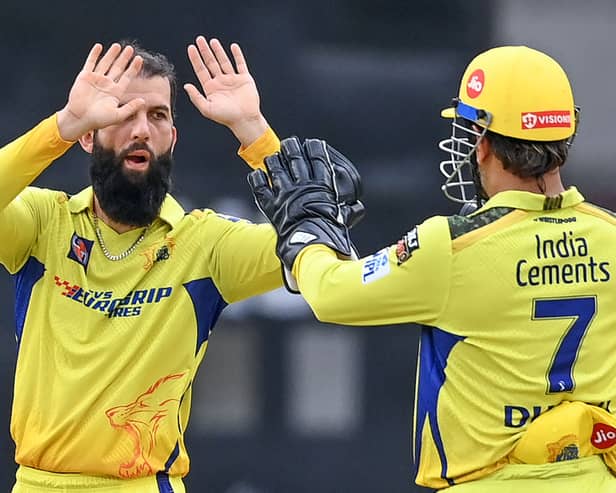 Moeen Ali celebrates with CSK captain MS Dhoni (R) in 2023 tournament
