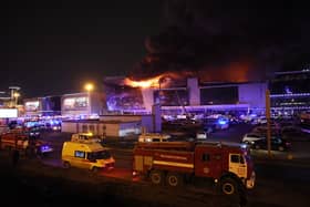Emergency services vehicles are seen outside the burning Crocus City Hall concert hall following the shooting incident in Krasnogorsk, outside Moscow, on March 22, 2024. Picture: Stringer/AFP via Getty Images