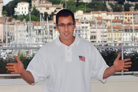  US actor Adam Sandler poses for photographers during the photocall for the film 'Punch-drunk love' by US director Paul Thomas Anderson 19 May 2002 during the 55th Cannes film festival. (ANNE-CHRISTINE POUJOULAT/AFP via Getty Images)