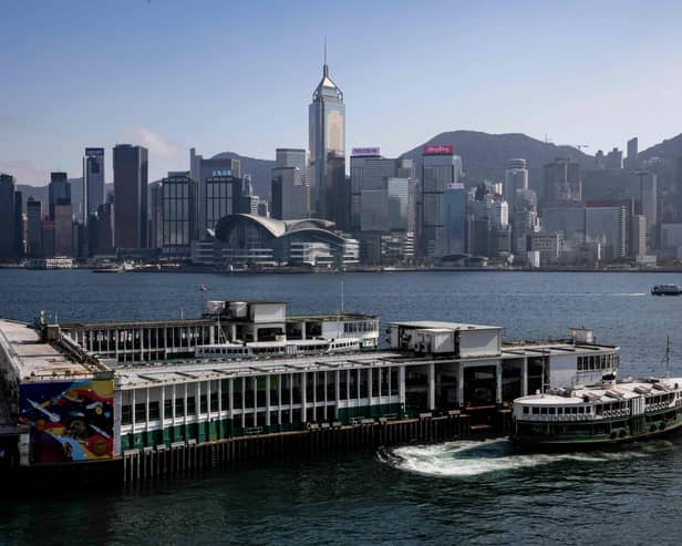 A general view of the Hong Kong skyline from the kowloon district of Hong Kong on February 2, 2023. - Hong Kong is ready to welcome the world back, its US-sanctioned leader told business and tourism heavyweights on February 2 as he pitched free flights and positive publicity to resurrect the once-vibrant global hub. (Photo by ISAAC LAWRENCE / AFP)