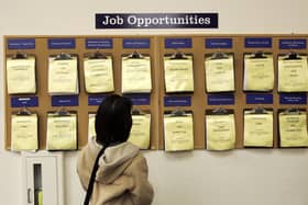 A job seeker looks at a job listing board (Photo: Justin Sullivan/Getty Images)