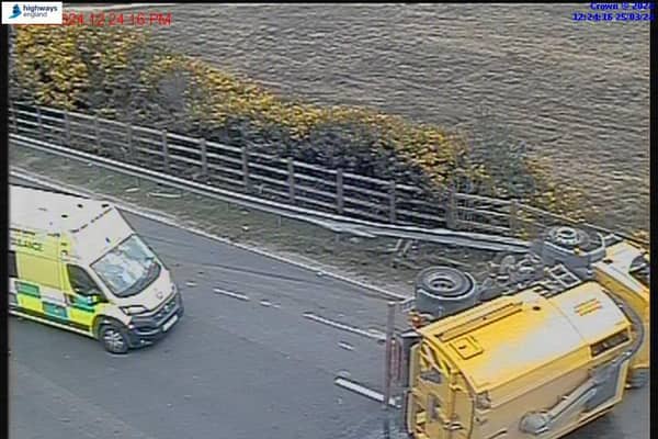 An overturned road sweeper is causing long delays on the M3