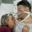 Susan Haworth with her son Jack Jermy-Doyle in hospital prior to his death. The mum of a trainee barrister who died after a fatal punch on a night out has urged people to stop 'needless violence'. Picture: Susan Haworth  / SWNS