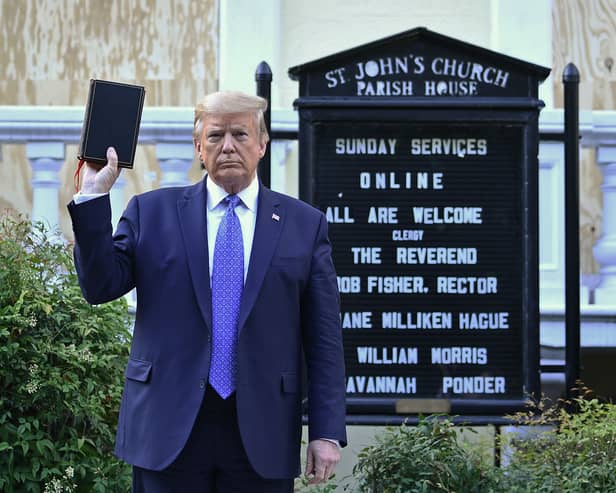 Then US President Donald Trump holds up a Bible outside of St John's Episcopal church in Washington, DC in 2020 (Photo: BRENDAN SMIALOWSKI/AFP via Getty Images)