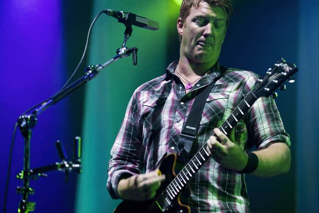 Josh Homme of the US american Rock group 'Queens of the Stone Age' performs on stage on August 22, 2010 during the 18th edition of the music festival Lowlands in Biddinghuizen.  (Marten van Dijl/AFP via Getty Images)